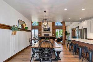 a kitchen and dining room with a table and chairs at Beech Blessings in Beech Mountain