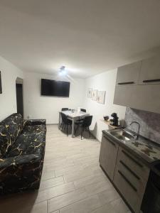 a living room with a couch and a table at Residenza Stella in Isernia +9 photos