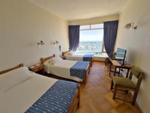 Ένα ή περισσότερα κρεβάτια σε δωμάτιο στο Hotel Panoramico