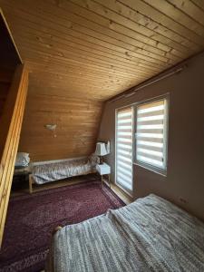Postel nebo postele na pokoji v ubytování Kuća Janjic Jahorina