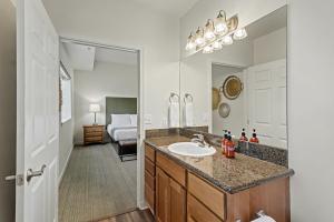 a bathroom with a sink and a mirror at Obertal Inn in Leavenworth +129 photos