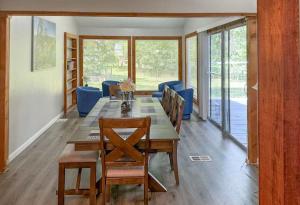 a dining room with a long table and chairs at SLAUGHTER in Austin