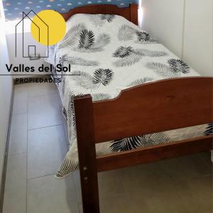 Ένα ή περισσότερα κρεβάτια σε δωμάτιο στο Arriendo Lindo Departamento a pasos de La Playa La Serena