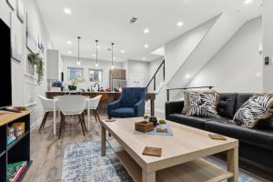 a living room with a couch and a table at The Opal 2BD TowenHouse 7ST Walkable in Fort Worth