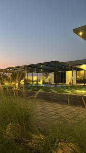 a large building with a lot of windows at لامور فيلا in Sohar +41 photos