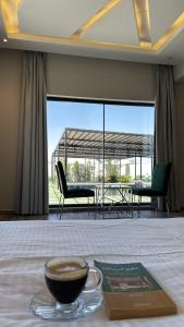 a bowl of coffee sitting on top of a table at لامور فيلا in Sohar