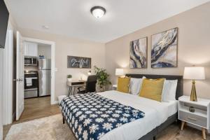 a bedroom with a bed and a desk in it at AT and T Walkable 1BD unit Live the Excitement in Arlington