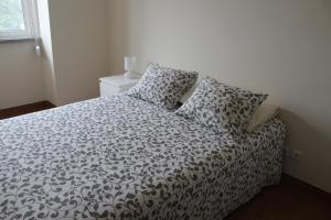 Giường trong phòng chung tại A casa do meu Avô