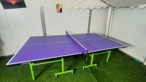 a purple ping pong table in a room at נופש חלומי בכנרת in Tiberias