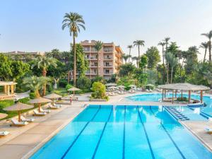 an image of a swimming pool at a resort at Pavillon Winter Luxor in Luxor
