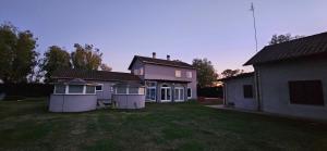a group of houses in a yard at Casa Botanica Boho Chic in Ostia Antica