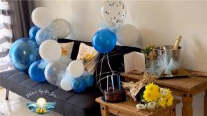 a bunch of blue and white balloons on a couch at Cozy Escape in Peyia, Sea Caves in Peyia +31 photos