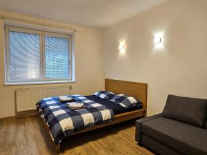 Ένα ή περισσότερα κρεβάτια σε δωμάτιο στο Apartment Stejskalova