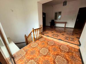 an empty room with a rug on the floor at Good nights in Tbilisi City