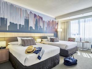 Ένα ή περισσότερα κρεβάτια σε δωμάτιο στο Mercure Perth