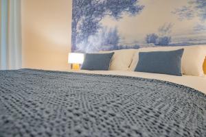 Postel nebo postele na pokoji v ubytování Cuneo Charme