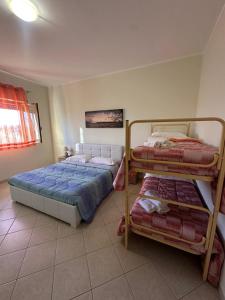 Postel nebo postele na pokoji v ubytování Heron House Appartaments