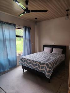 Ένα ή περισσότερα κρεβάτια σε δωμάτιο στο Casita Guarumo