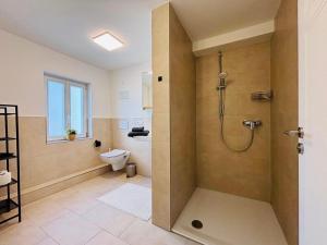 Koupelna v ubytování Aposto Apartments am Marktplatz 13 + 11 fotografií