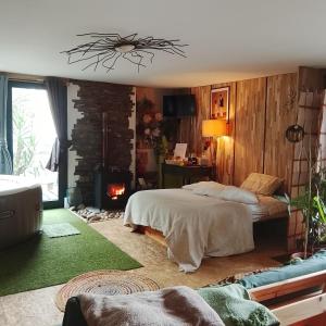 a bedroom with two beds and a fire place at Alojamento 444 in Monção