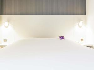 Postel nebo postele na pokoji v ubytování Mercure Strasbourg Centre Petite France