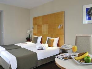 Ένα ή περισσότερα κρεβάτια σε δωμάτιο στο Mercure Budapest Korona +112 φωτογραφίες