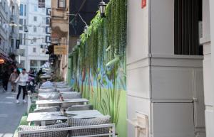 a row of tables on the side of a building at Imperium Taxim in Istanbul