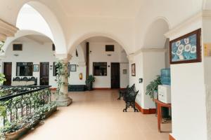 a hallway of a building with arches at Hotel Nueva Antequera in Oaxaca City