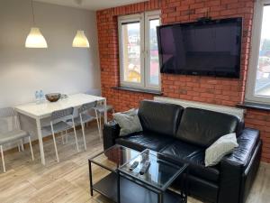 Μια τηλεόραση ή/και κέντρο ψυχαγωγίας στο Apartament w centrum