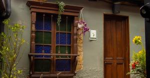 a door to a building with a window at Hotel Quinta Bolivar in Bogotá +91 photos