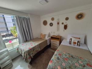 Ένα ή περισσότερα κρεβάτια σε δωμάτιο στο Flat Mar Bello Plaza +14 φωτογραφίες