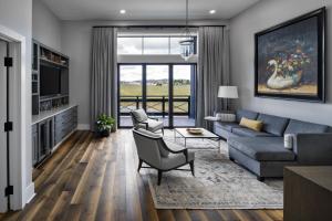 a living room with a couch and a tv at Nicewonder Farm & Vineyards in Bristol