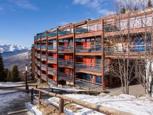 a building with scaffolding on it in the snow at Appartement 6 pers · Balcon · Wifi gratuit · Parking - FR-1-346-559 in Arc 1800 +16 photos