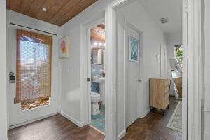 a bathroom with a toilet and a window at Zen Beach House, Steps From Atlantic Ave And Beach in Delray Beach +53 photos