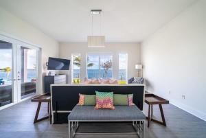 a living room with a couch and a view of the ocean at Bimini Breeze Villa in Bailey Town