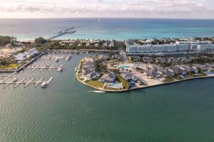 an aerial view of a resort with boats in the water at Bimini Breeze Villa in Bailey Town