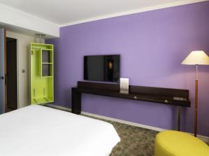 Ένα ή περισσότερα κρεβάτια σε δωμάτιο στο ibis Styles Evry Courcouronnes Hotel and Events +84 φωτογραφίες