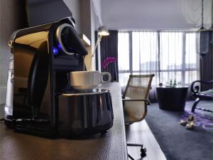 a coffee maker sitting on a counter in a room at Sofitel Saigon Plaza in Ho Chi Minh City +152 photos