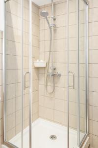a shower with a glass enclosure in a bathroom at Casa Segunda in Tías