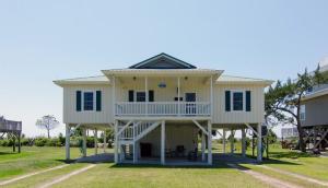 a large house with a wrap around porch at Sound Choice in Edisto Island
