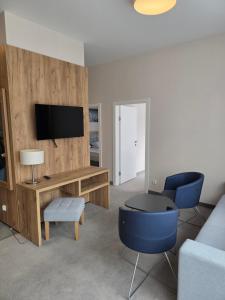 Μια τηλεόραση ή/και κέντρο ψυχαγωγίας στο Aparthotel Apartamenty Czarna Góra 412
