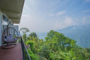 a balcony of a house with a view of the mountains at The Ledge Ella in Ella