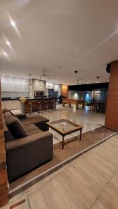a living room with a couch and a coffee table at Quinta Los Castillos in Itá