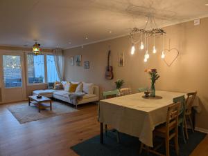 a living room with a table and a couch at Home in Vingåker in Vingåker