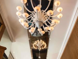a chandelier hanging from a ceiling in a room at Sofitel Beirut Le Gabriel in Beirut