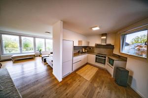 a large room with a kitchen and a living room at Ferienwohnung Auerose in Wesel