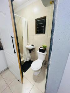 a bathroom with a toilet and a sink at Legae la rena in Vosburg
