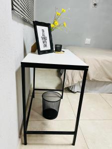 a black and white table with a sign on it at Legae la rena in Vosburg
