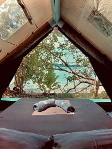 a view from the inside of a tent with a window at Bubble Paradise, Koh ta Kiev in Koh Ta kiev Island