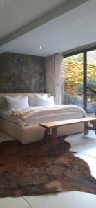 Postel nebo postele na pokoji v ubytování La Suite Quatre de Saint Jean